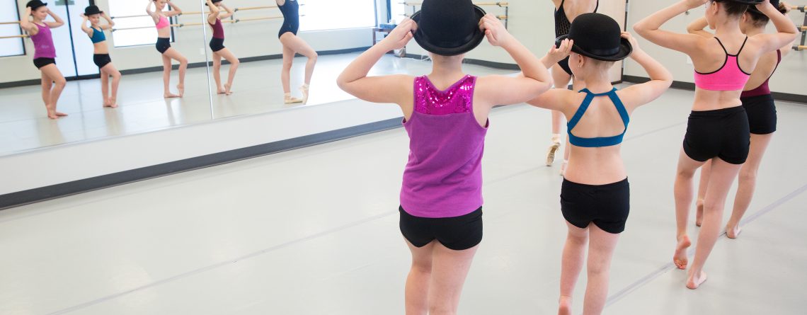 Young dancers perform in their musical theater class at their dance studio