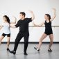 Teenage tap dancers in their local dance studio take class together